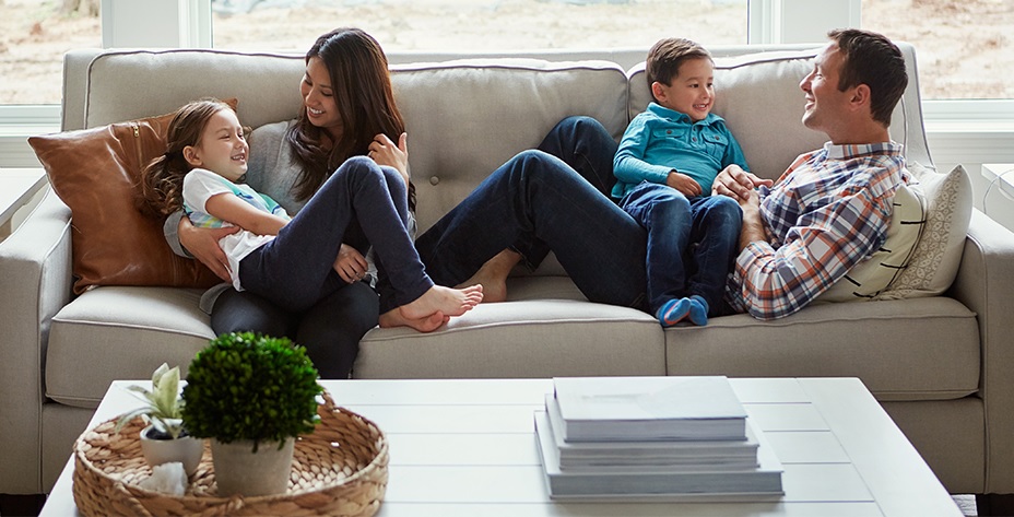 insulation contractors near syracuse ny image of family looking comfortable on couch at home from zerodraft